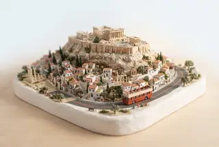 Miniature model of Athens with an orange sightseeing bus