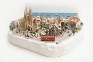 Miniature model of Barcelona with an orange sightseeing bus