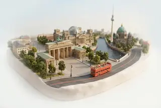 Miniature model of Berlin with an orange sightseeing bus