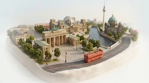 Miniature model of Berlin with an orange sightseeing bus