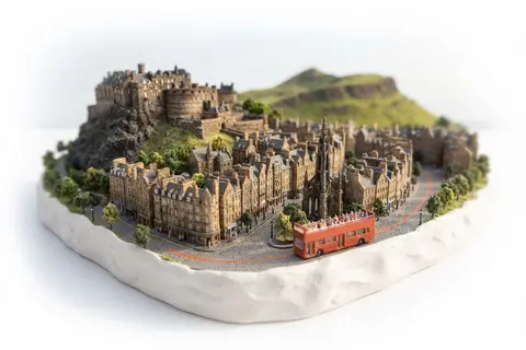 Miniature model of Edinburgh with an orange sightseeing bus