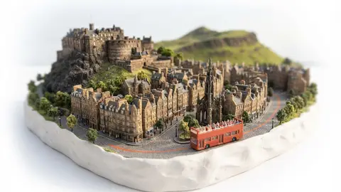 Miniature model of Edinburgh with an orange sightseeing bus