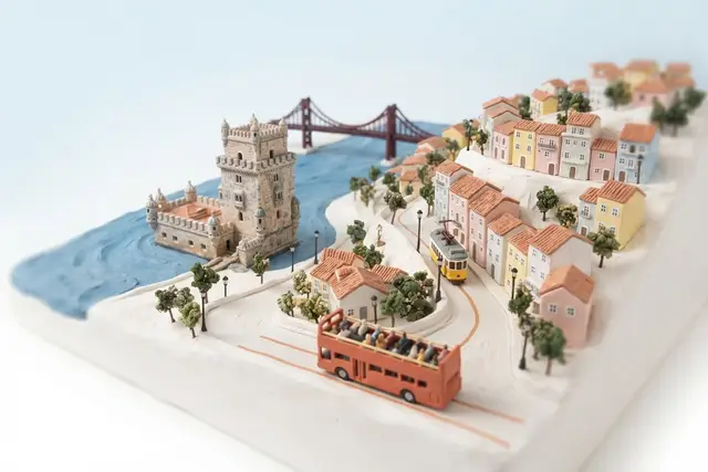 Miniature model of Lisbon with an orange sightseeing bus