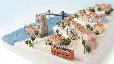 Miniature model of Lisbon with an orange sightseeing bus