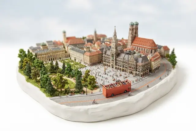 Miniature model of Munich with an orange sightseeing bus