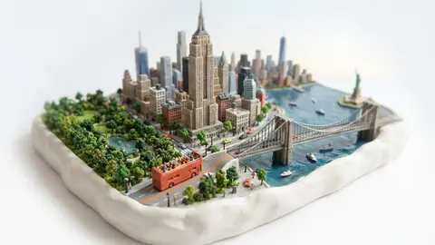 Miniature model of New York with an orange sightseeing bus