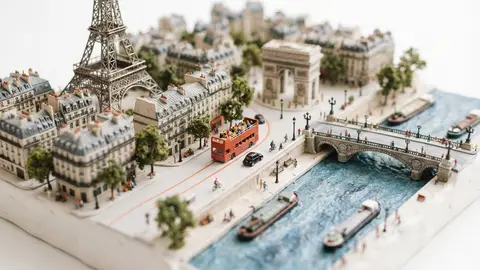 Miniature model of Paris with an orange sightseeing bus