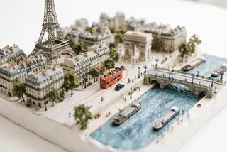Miniature model of Paris with an orange sightseeing bus