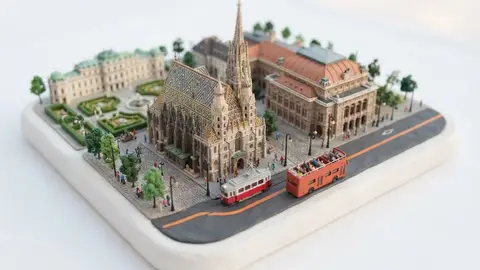 Miniature model of Vienna with an orange sightseeing bus