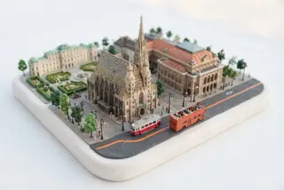 Miniature model of Vienna with an orange sightseeing bus