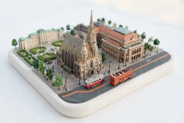 Miniature model of Vienna with an orange sightseeing bus